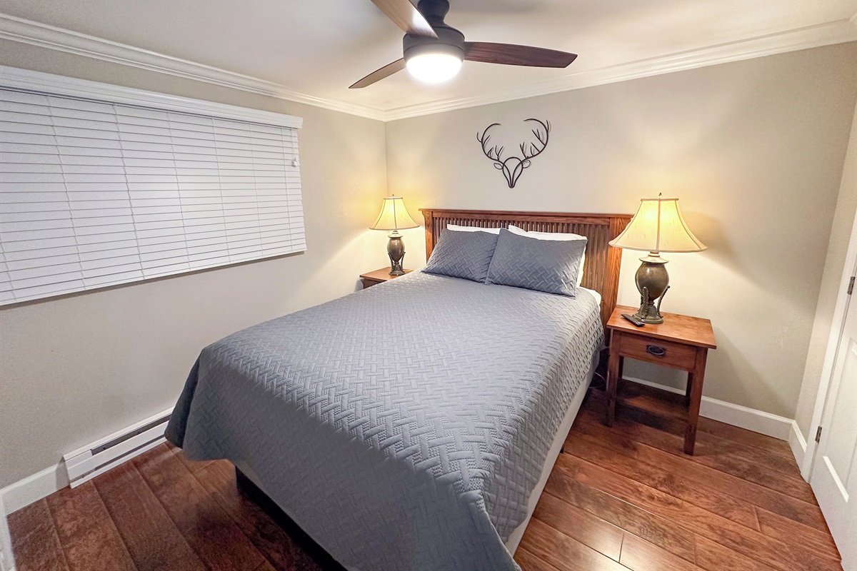Queen bed with large 50" Smart TV in the Master Bedroom.