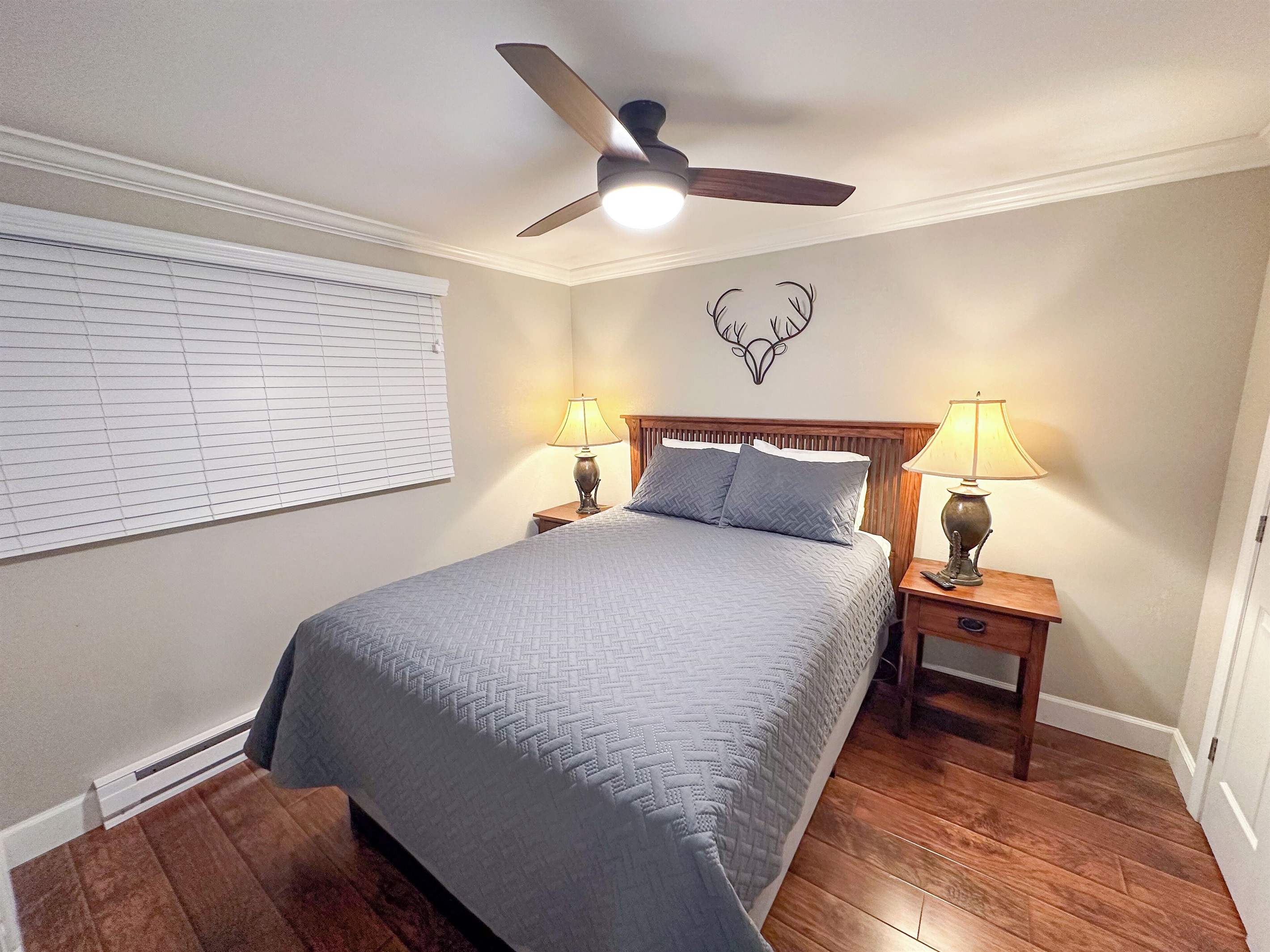 Queen bed with large 50" Smart TV in the Master Bedroom.
