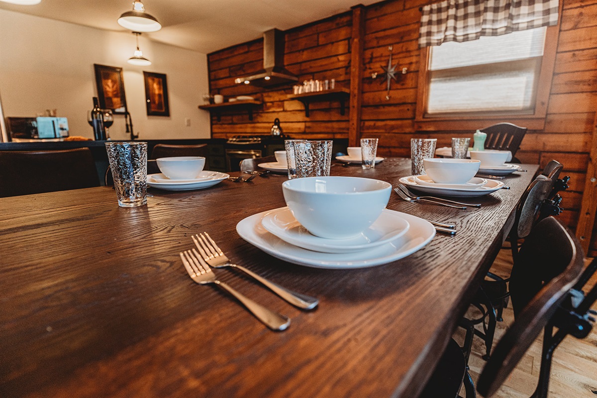Gather around the spacious dining table in the heart of the kitchen, perfect for shared meals and family conversations