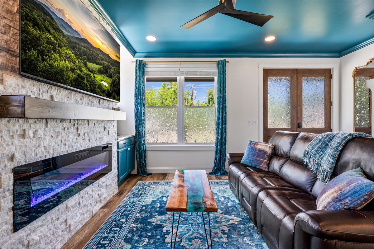 The electric fireplace creates a warm glow and cozy atmosphere year-round.