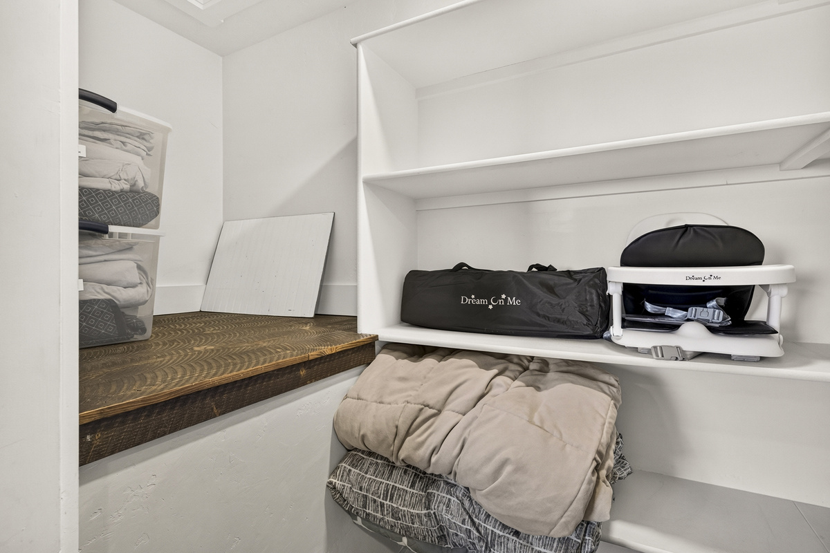 Upstairs closet in living room.