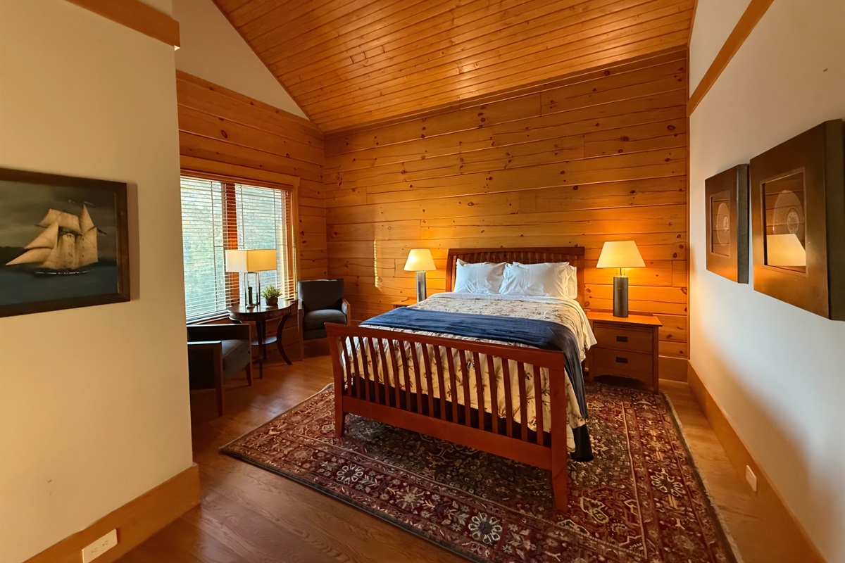 Third bedroom in main house with a queen bed