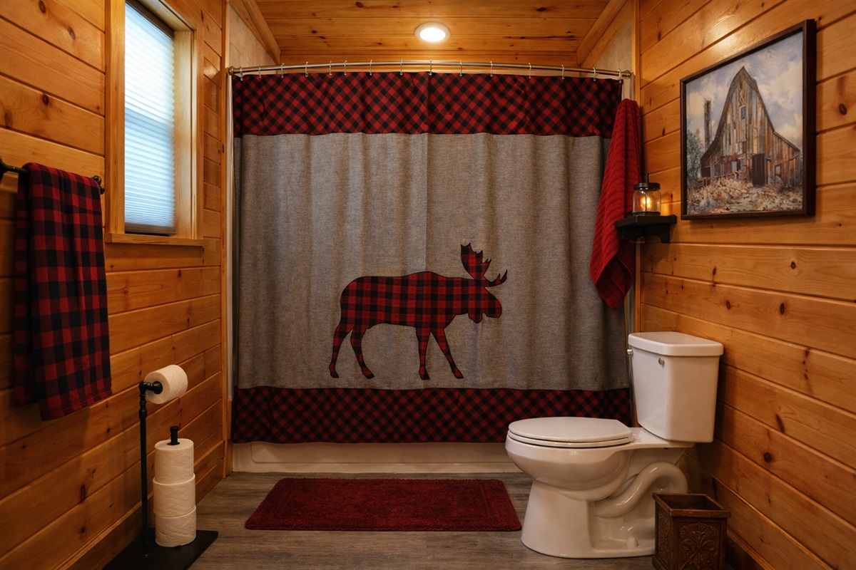 Second ensuite bathroom with combination shower and tub.