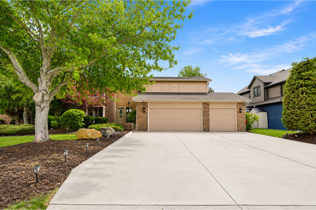 Gracing the heart of a meticulously maintained, lush landscape, this striking single-family residence commands attention with its clean, contemporary aesthetic and thoughtfully curated exterior details.