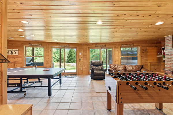 Bring everyone together in the spacious game room featuring multiple entertainment options.