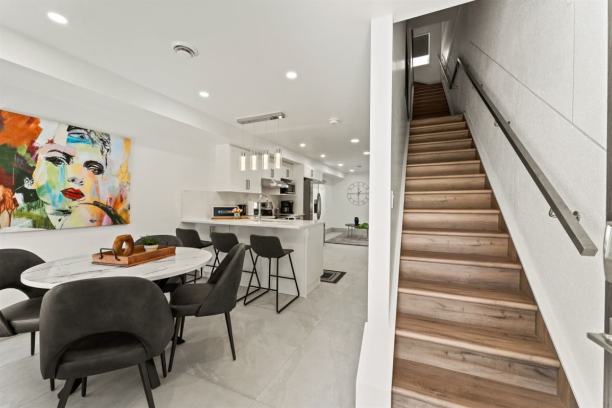 Stairs leading to the 2nd and 3rd floor bedroom areas.