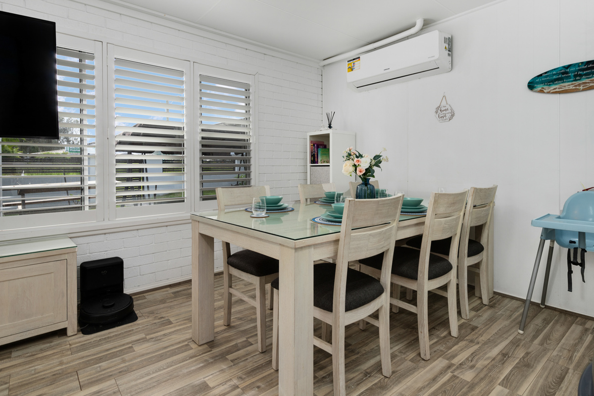 A second dining area helps Skye’s Beach House work across both levels, giving the downstairs zone its own easy meal setup.
