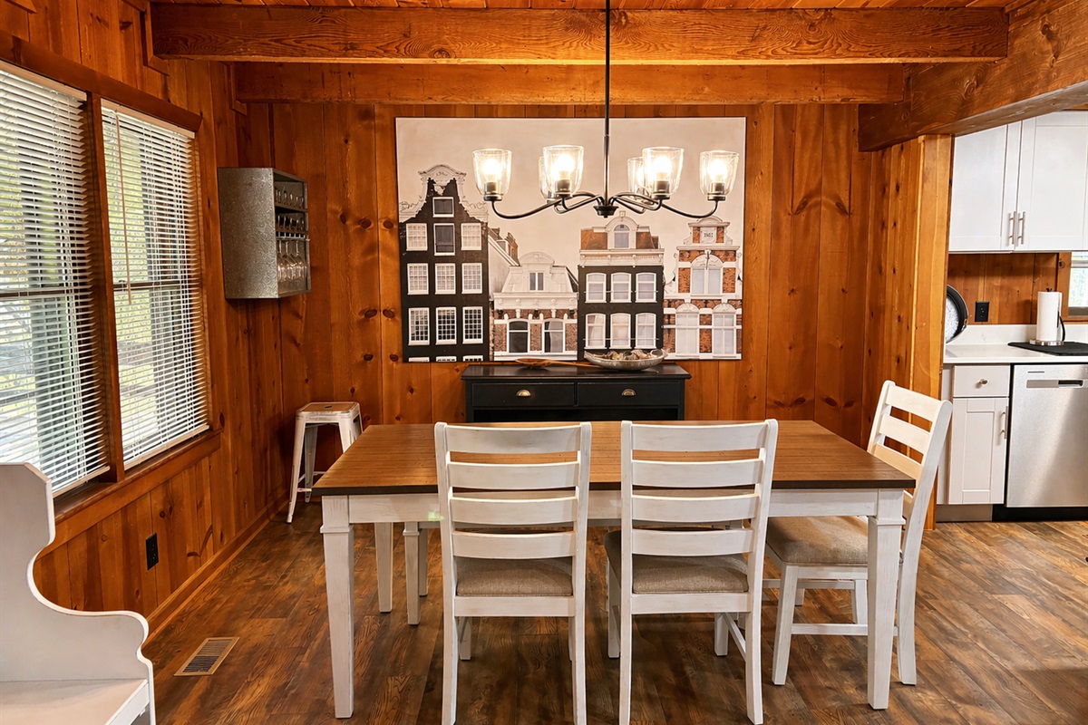 Charming Bavarian-inspired dining nook with rich wood paneling, warm ambient lighting, and cozy alpine character—perfect for gathering over hearty meals and creating unforgettable mountain memories.