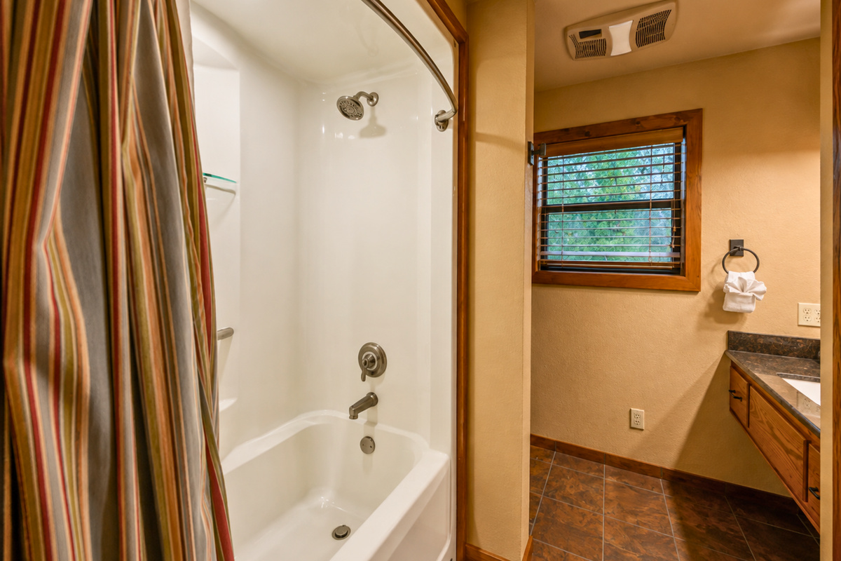 A tub and shower combination makes this bathroom especially convenient for families while still keeping the space simple and comfortable.