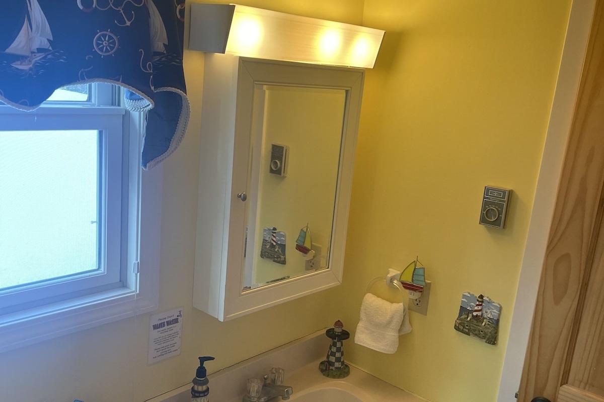 Upper Level Jack and Jill Bathroom - Combination tub/shower, sink and toilet