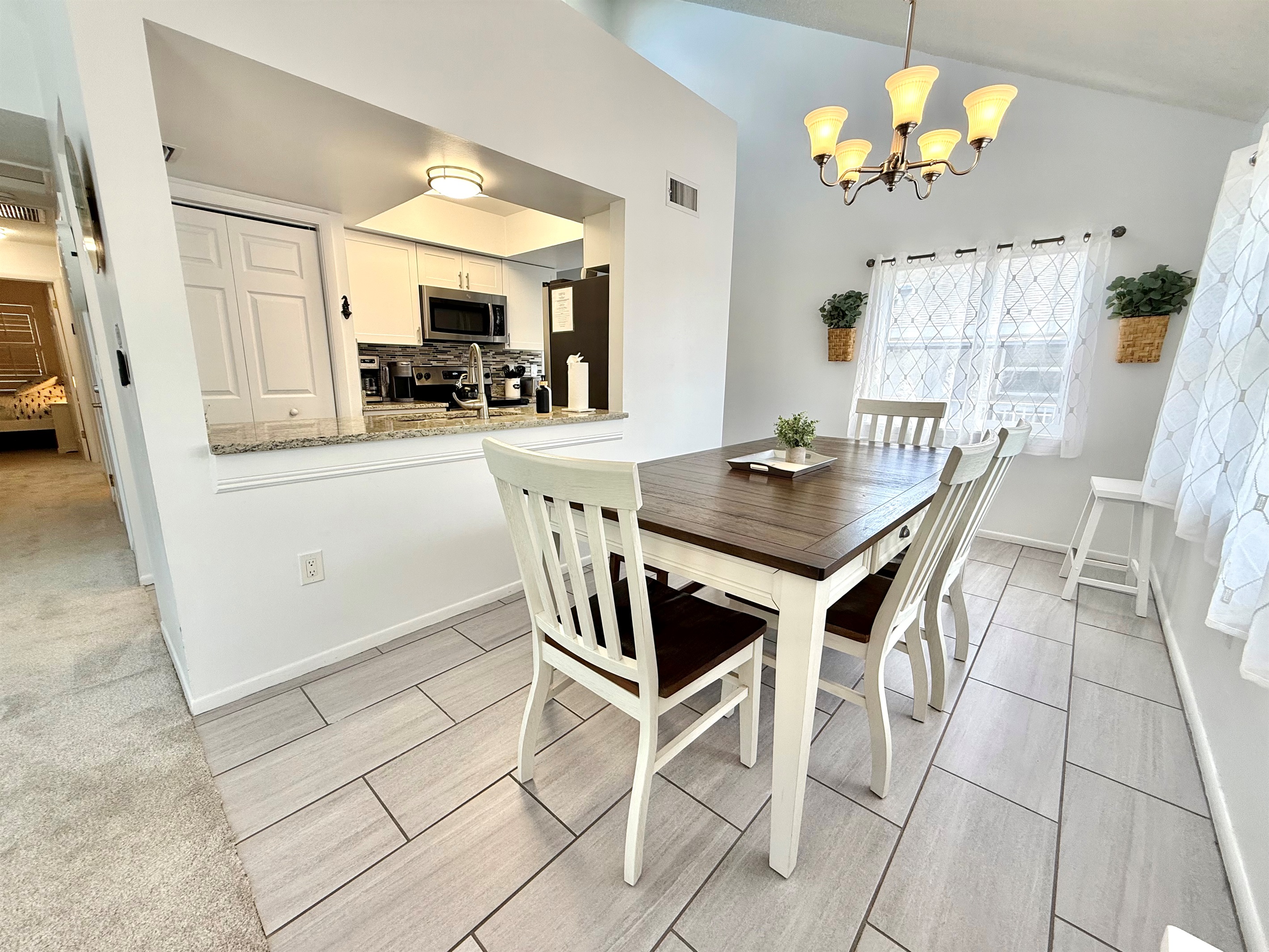 Situated right off the kitchen, this dining area makes serving and entertaining simple.