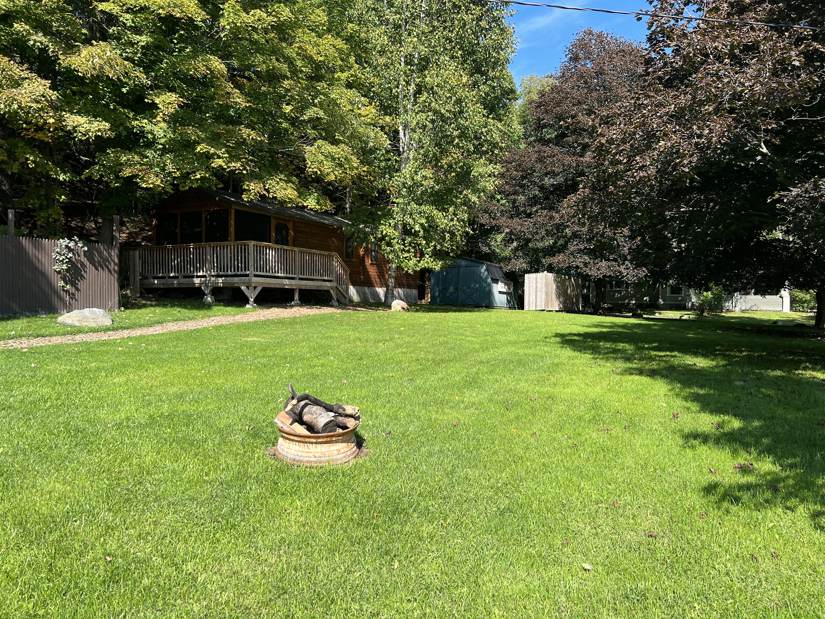 Large lawn in front of the cabin.