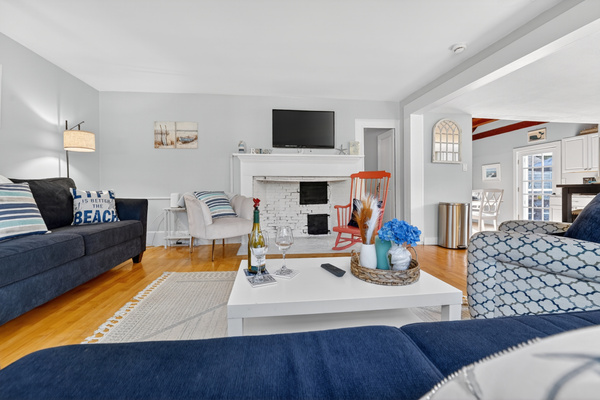 Spacious lounge with coastal charm and inviting seating throughout.