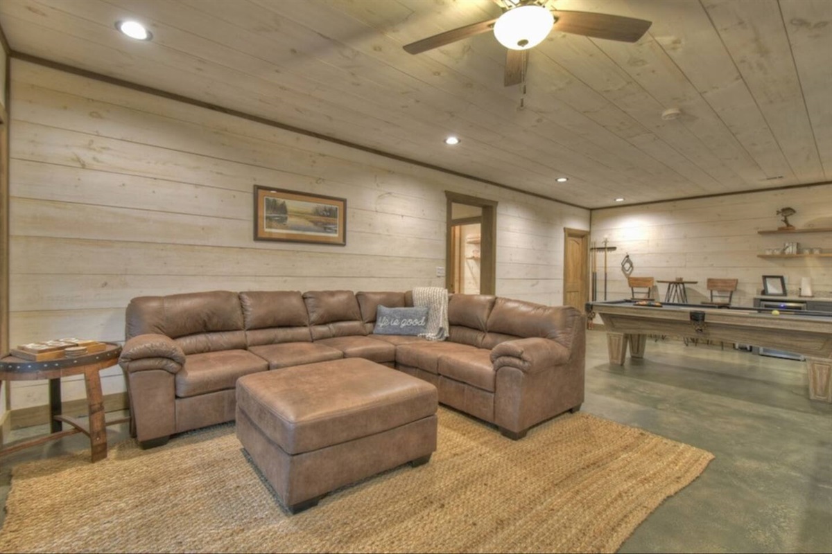 Another view of our game room and sectional.  Foot stool is big enough to push in near couch to make an extra sleeping space.