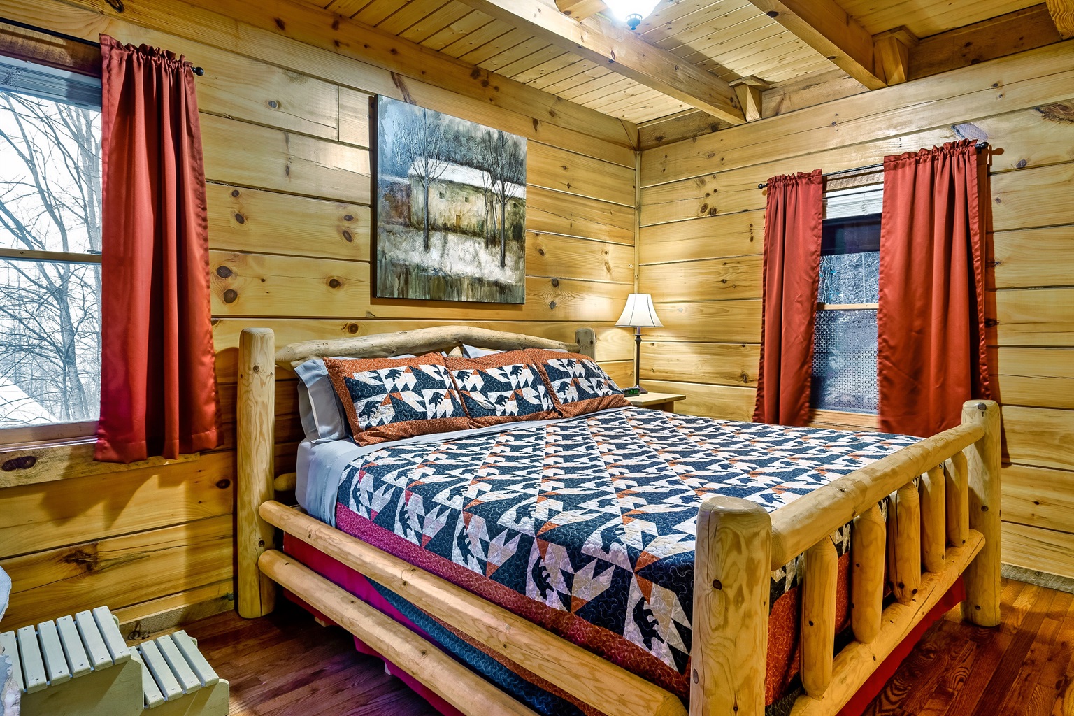 Main bedroom with king-size log bed
