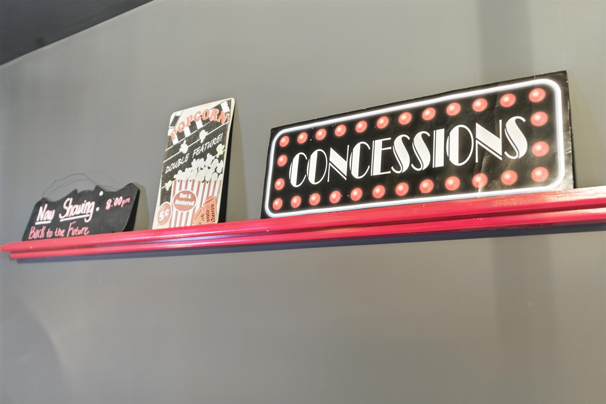 Movie-themed decor creates a fun theater vibe