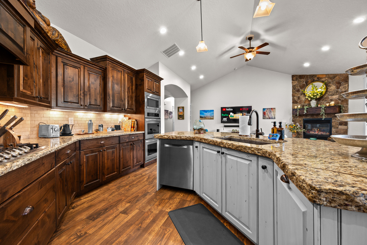 Designed for Entertaining – The spacious open-concept kitchen offers generous counter space, a large island, and seamless access to the dining and living areas, making it easy to keep everyone together.