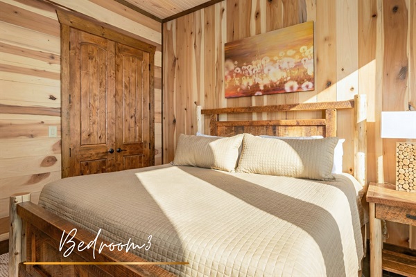 This king bedroom offers a cozy retreat with plenty of natural light and peaceful vibes.