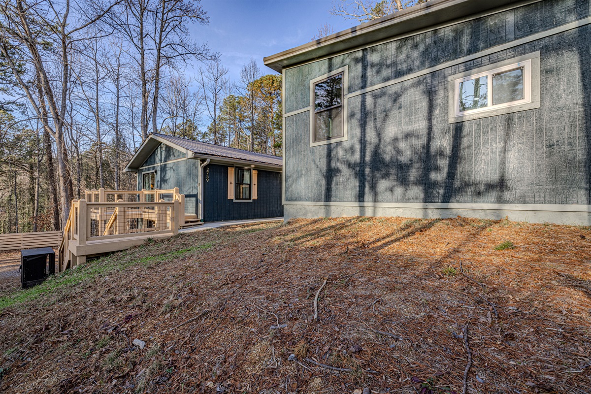 Mid Mod Mountain Bliss features a striking contemporary design that sits harmoniously within its wooded sloping landscape.