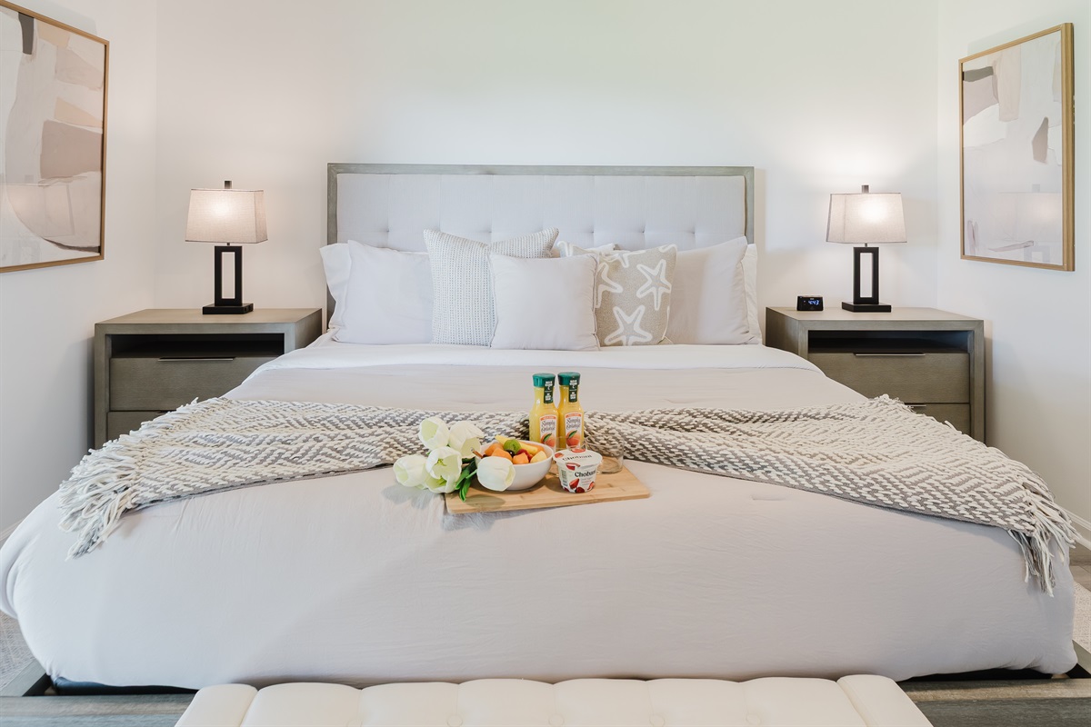 Spacious primary suite with a comfortable king bed and a serene atmosphere. Relaxing retreat designed for restful nights and peaceful mornings. Thoughtfully designed bedroom with hotel-quality comfort