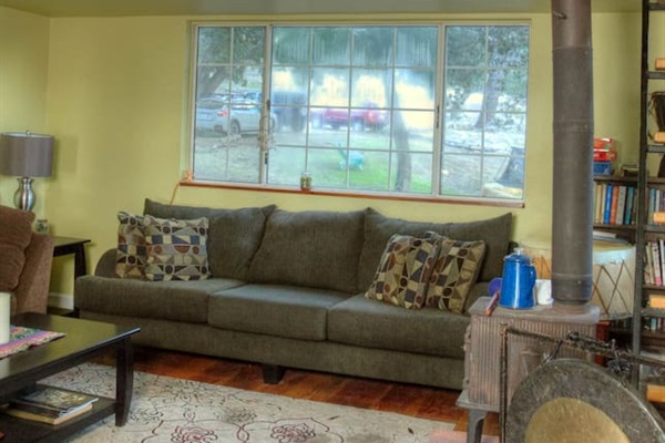 Living room with another queen bed in loft