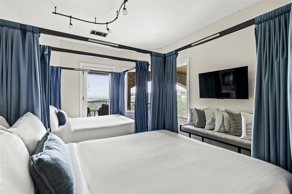 Bedroom 6 - 2 Queen beds with privacy curtains. Located upstairs with a private balcony facing the downtown skyline.