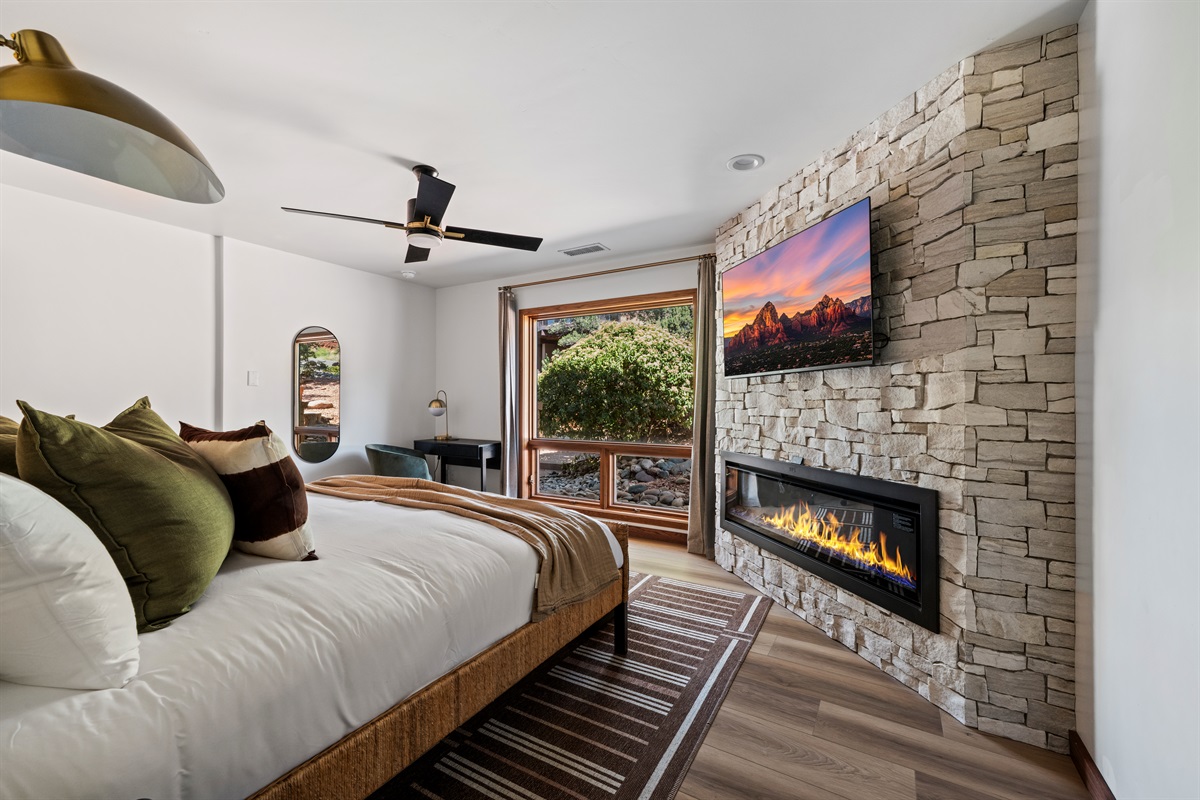 King Bedroom 2
Cozy king retreat with modern fireplace and serene natural surroundings.