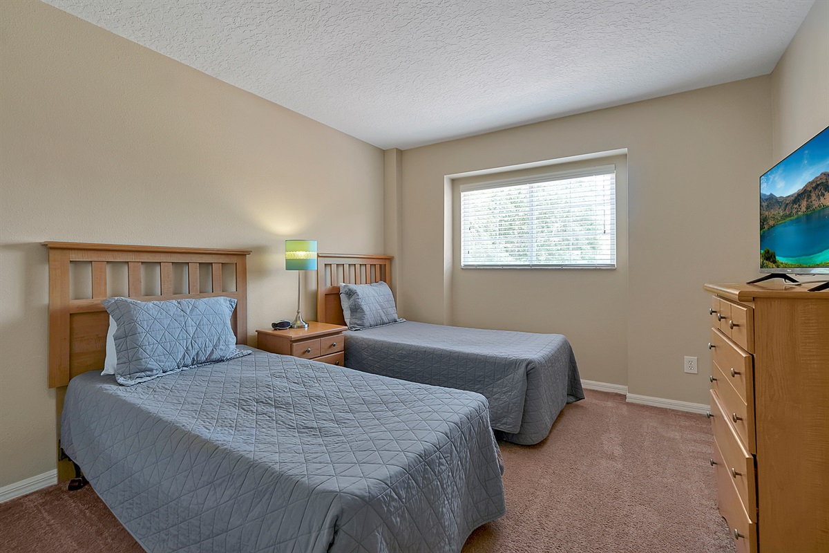 Flexible sleeping: The first of two twin bedrooms, providing separate comfort for children, colleagues or solo travelers