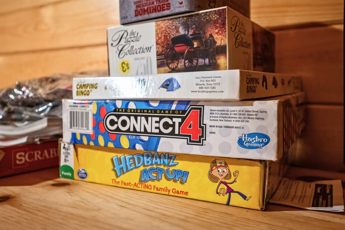 Cabin includes a collection of classic board games like Connect 4, Scrabble, and Hedbanz for family fun.