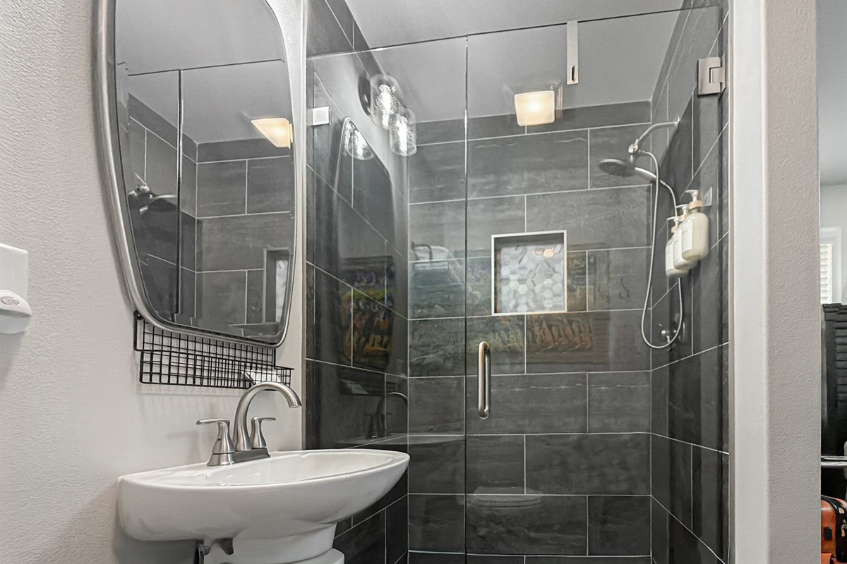 Take a long hot shower in the tiled walk-in — the end-of-day reset a full day in Hot Springs earns you.