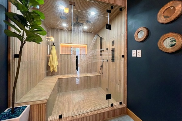 Large steamroom with aromatherapy, audio and light therapy, rain shower, multiple body sprays, handheld shower