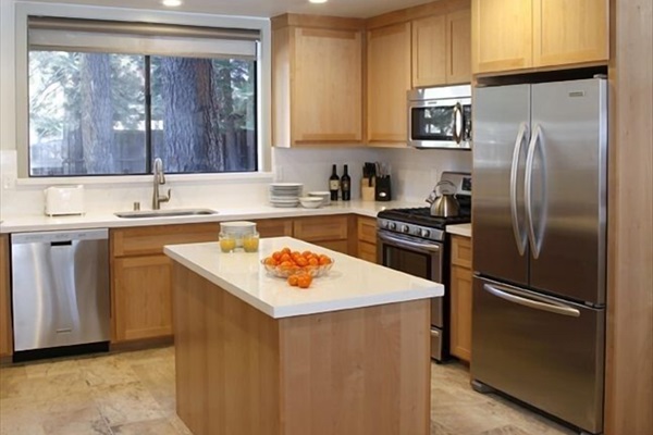 Fully equipped kitchen with beverage fridge under island