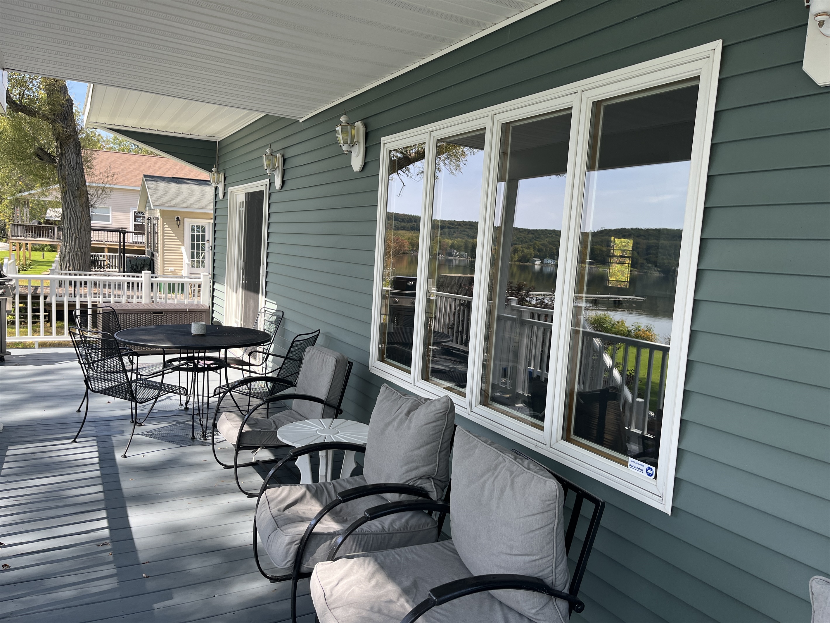 Covered deck overlooking the waters of Canadarago Lake
