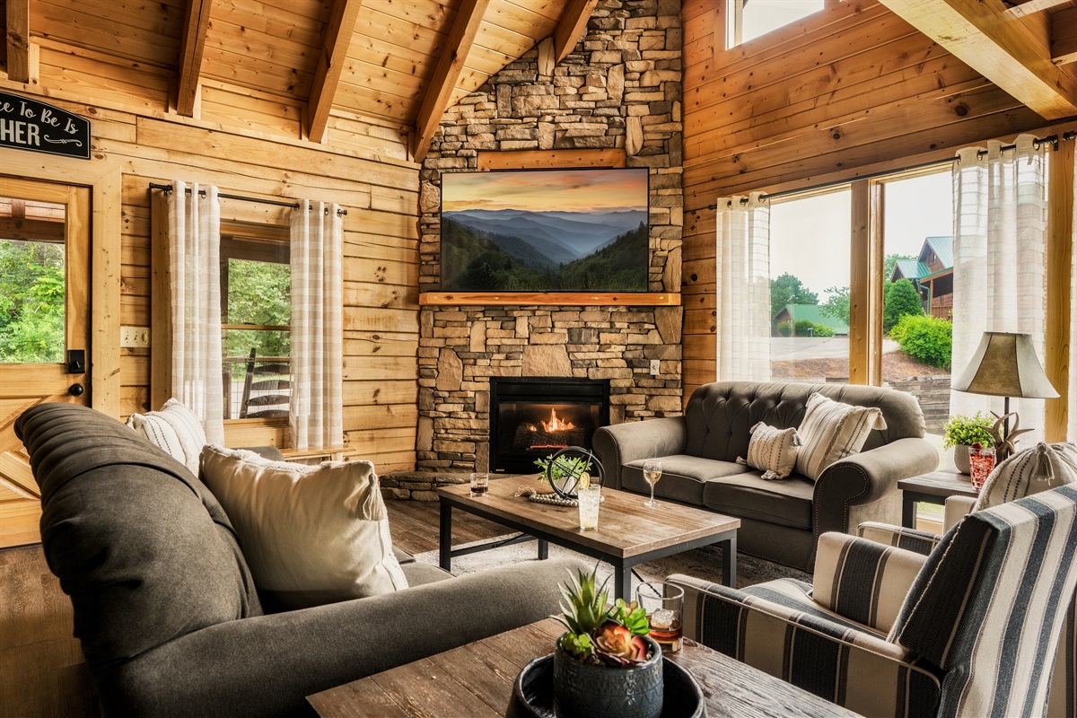 Main floor cabin living space is light, bright,and welcoming. 70" smart Roku TV for streaming.