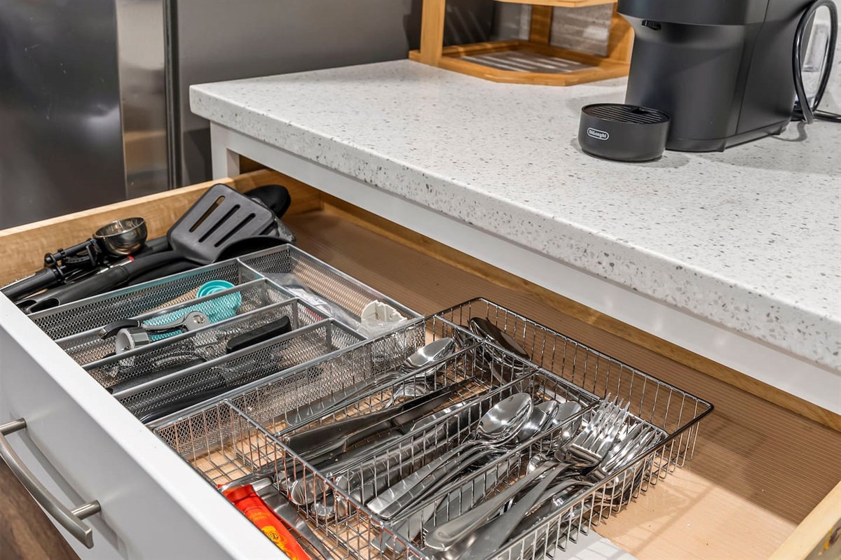 Fully stocked utensil drawer with cutlery, cooking tools, and kitchen essentials for daily use.