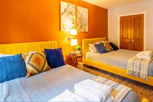 Relax and recharge in this vibrant Queen Bedroom!