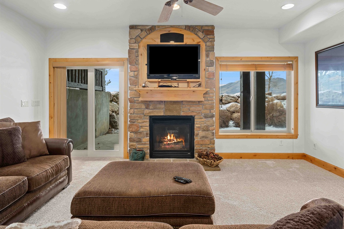 Spacious second living area with cozy seating and mountain lodge ambiance.
