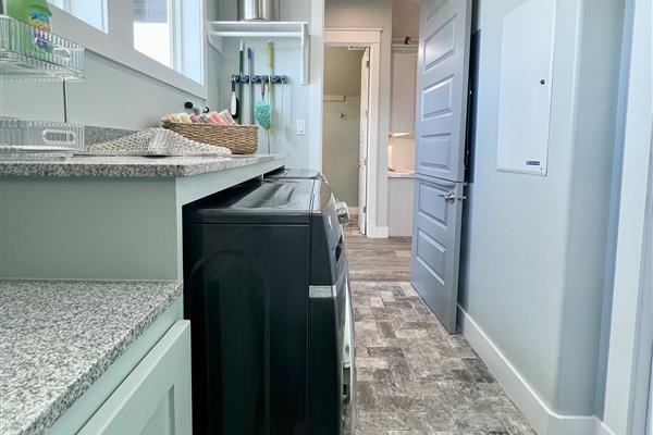 Crystal Paradise Laundry: Convenient laundry area with modern washer and dryer hookups.