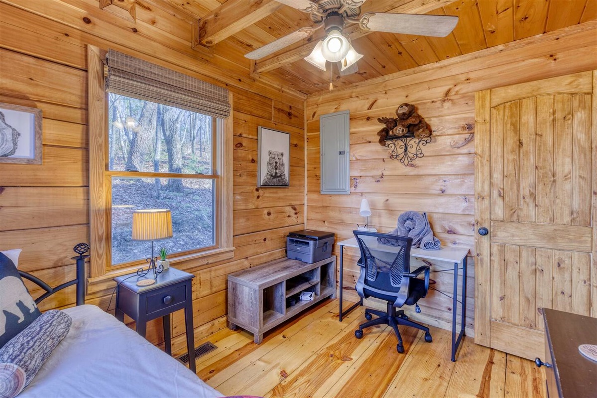 Main floor bedroom with the trundle bed (two twins) and also desk and printer for workspace.