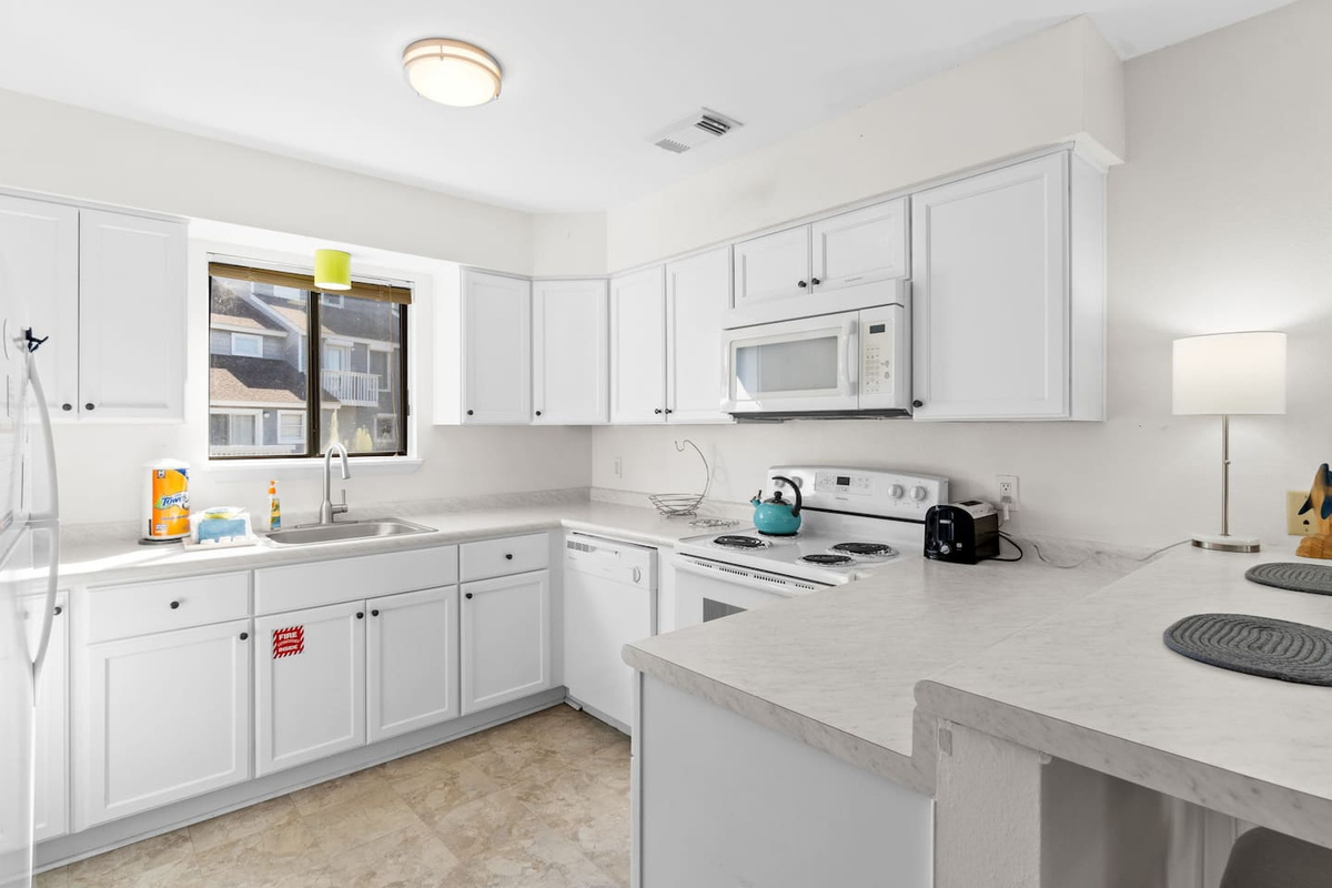 Cook a real meal here &mdash; the kitchen is stocked, well-lit, and laid out for people who actually use a kitchen on vacation.