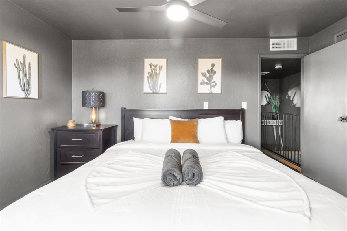 King bedroom with soft linens, bedside lighting, and a calm place to rest.