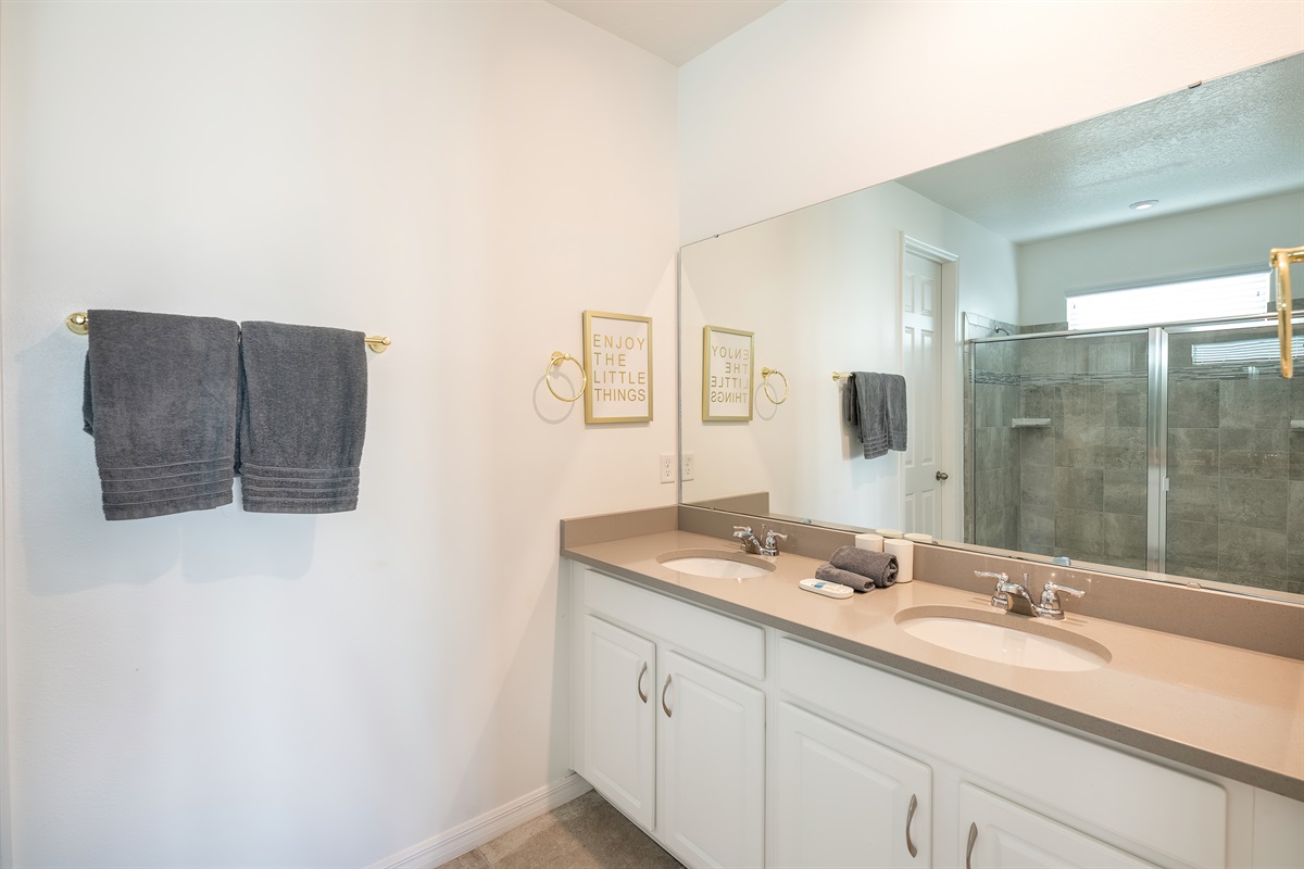 Master Bath 1: Double sinks and vibrant decor make this space perfect for a refreshing start!