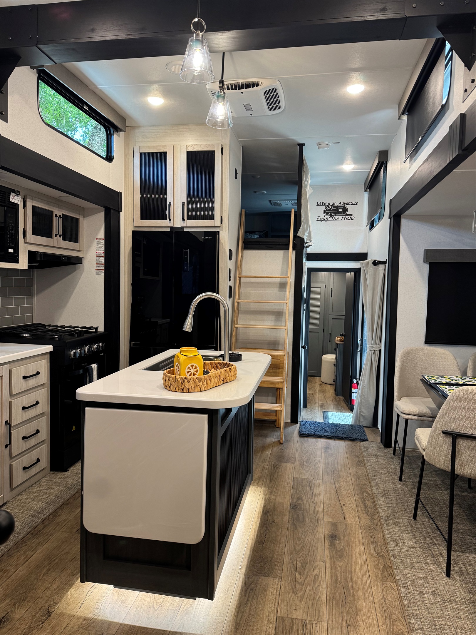 Kitchen leading up to one loft room