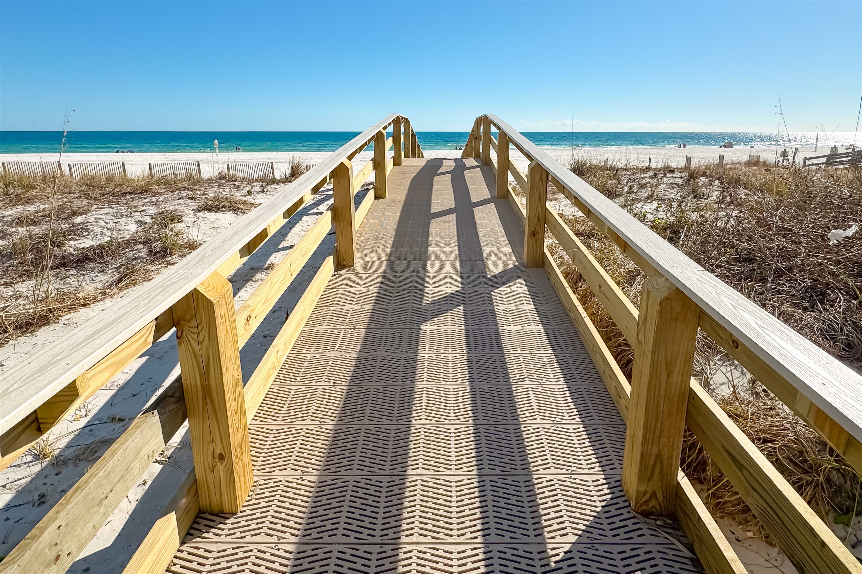 Experience effortless beach days at Four Winds. Our beautifully maintained boardwalk offers a direct and picturesque route to the stunning coastline, inviting you to relax and enjoy.