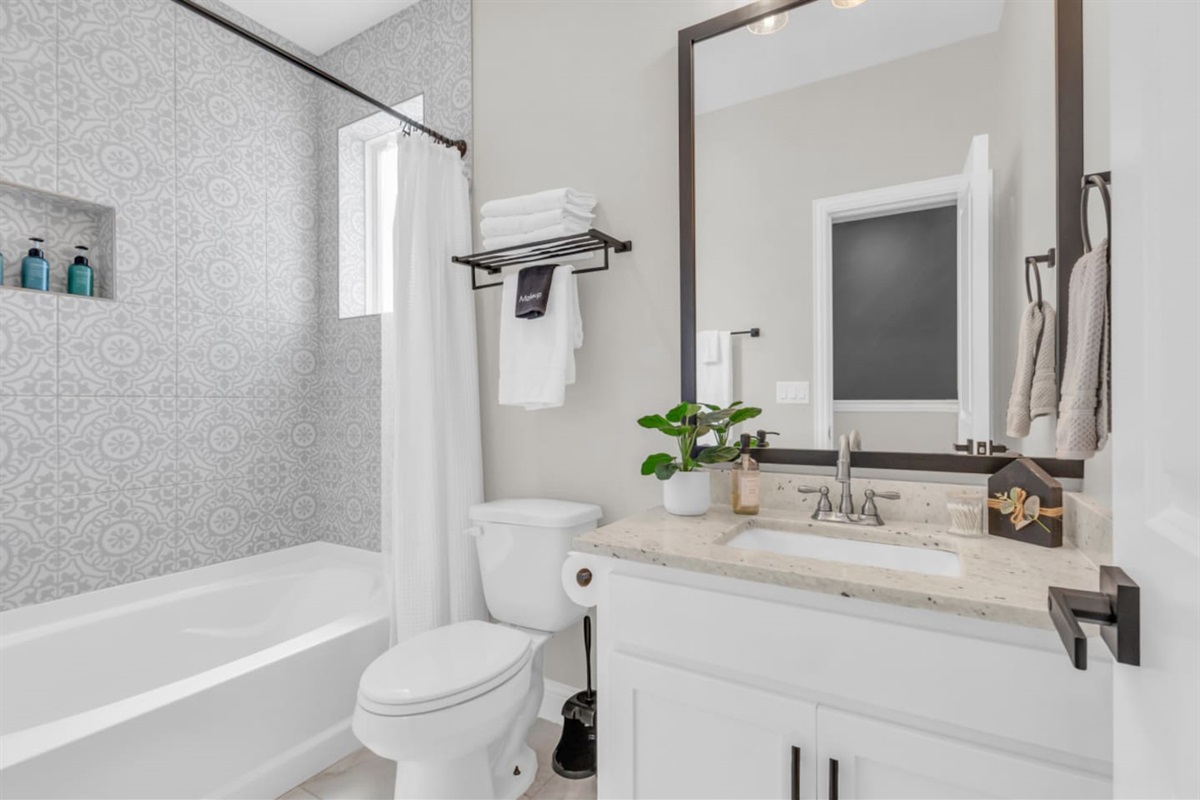 Guest bathroom with vanity, storage, and modern finishes.
