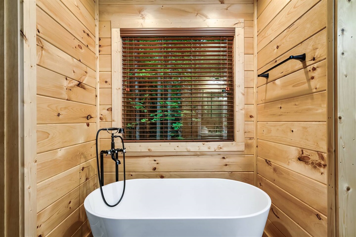 Upstairs bathroom with soaker tub and shower.