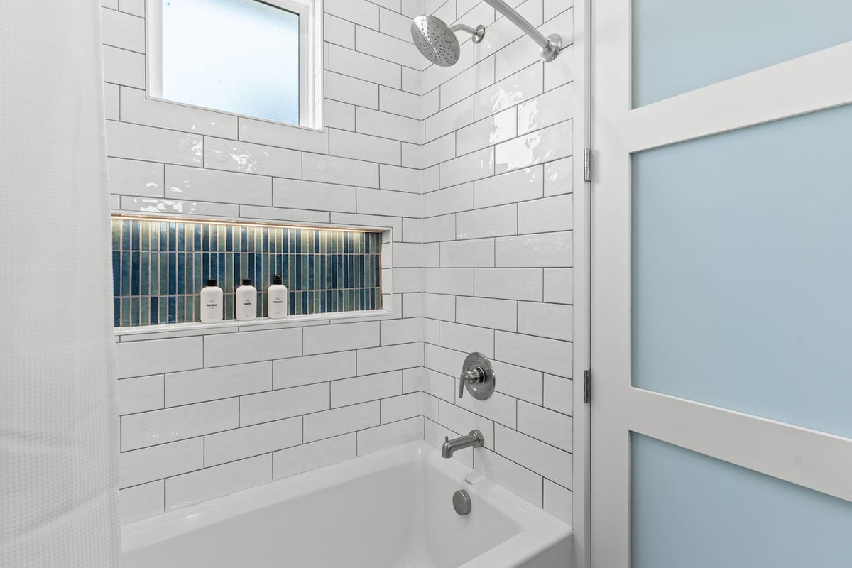 Family-friendly details make vacation easier. The bunk room bathrooms include a tub/shower combo for kids’ bath time, plus a step stool at the sink so little ones can easily wash up and get ready on their own.