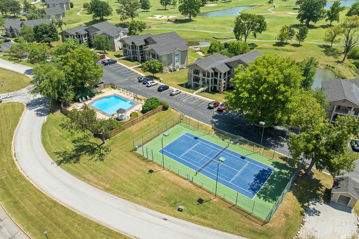 A broader look at Holiday Hills shows the pool, courts, and golf-course setting that make the resort feel more than just a place to sleep.