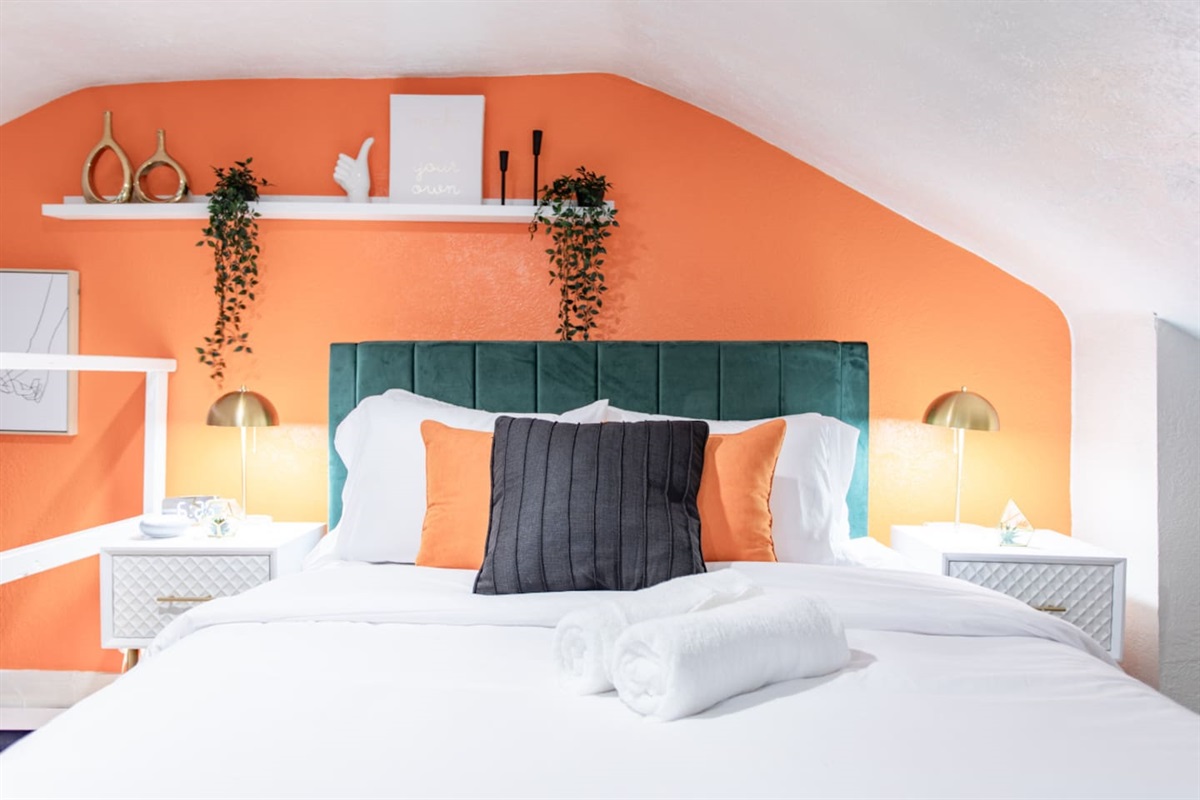 An elegant bedroom with refined accents, such as decorative throw pillows, stylish lighting, and tasteful artwork, adding a touch of sophistication and warmth to the space.