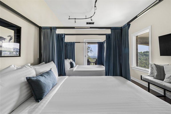 Bedroom 6 - 2 Queen beds with privacy curtains. Located upstairs with a private balcony facing the downtown skyline.